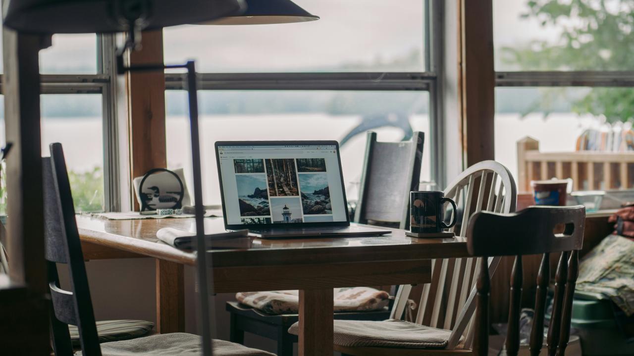 macbook pro on brown wooden table